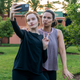 Julia Garner and Katie Lowes in Inventing Anna